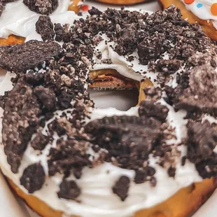 a donut with white frosting and cookies