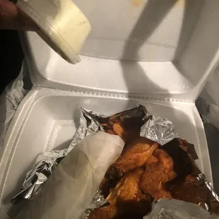 Very small cup of blue cheese with wings