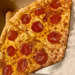 a slice of pepperoni pizza