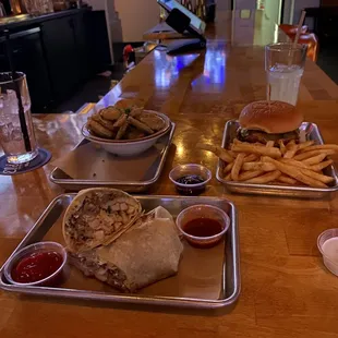 Breakfast burrito, fried pickles, and a chicken sandwich