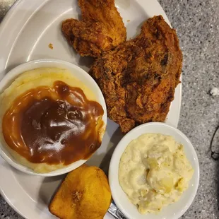 Fried chicken, potato salad and mashed potatoes