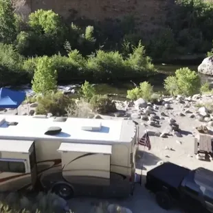 a camper and a car in a parking lot
