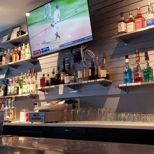 a bar with many bottles of alcohol