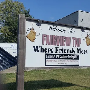 a sign in front of a building