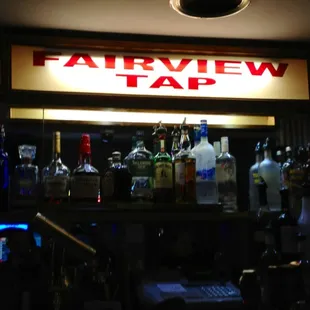 a bar with bottles of alcohol