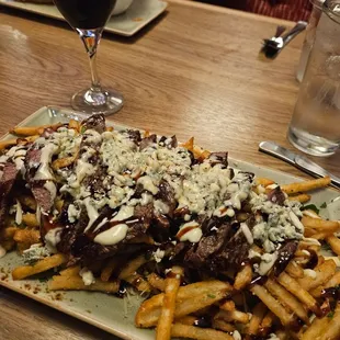 Steak with blue cheese and garlic parmesan fries.