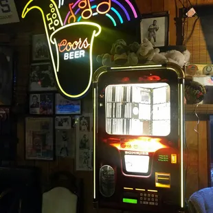 a neon sign above a slot machine
