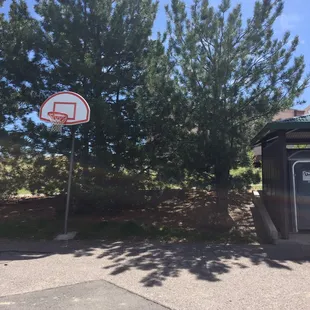Basketball hoop to shoot around in the parking lot.