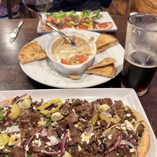 Eggplant hummus, Mediterranean flatbread with steak, gyro flatbread and of course the butter cake!