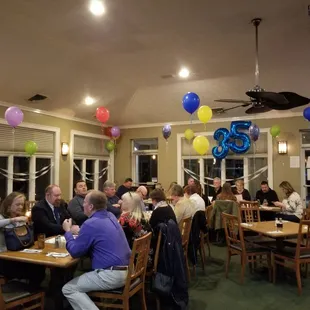 a large group of people sitting at tables