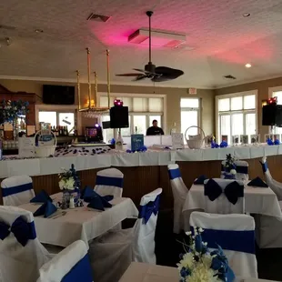 tables covered with white and blue linens