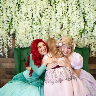 Creating magical memories! Our Mermaid Princess and Tower Princess sharing hugs and smiles with a little guest at a Royal Tea.