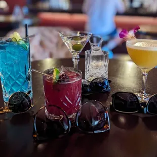 a variety of cocktails on a table