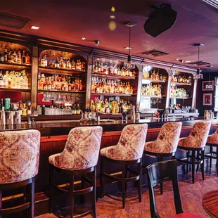 a bar with many bottles of alcohol