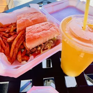 Cuban sandwich with grilled onions and a mango smoothie