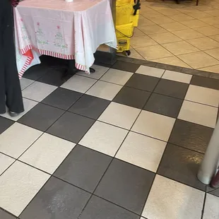 Dirty mop bucket in lobby