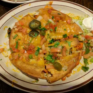 Veggie Mexican pizza! Veggies sandwiched between two fried tortillas (?)