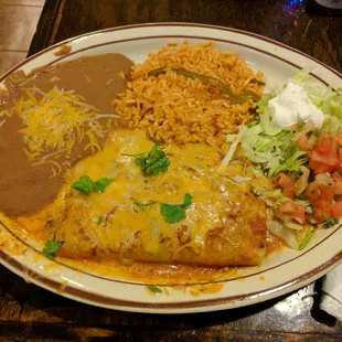 Spinach and cheese enchilada with refried beans, rice, sour cream, pico de gallo