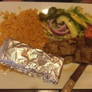 Carne asada, avocado, rice and tortillas.