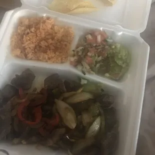 a meal in a styrofoam container