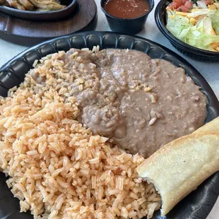 Rice beans, and part of a taquito