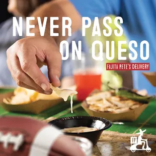 a man dipping cheese into a bowl