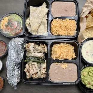 Chicken fajita, chicken quesadilla, chips, queso, and guacamole