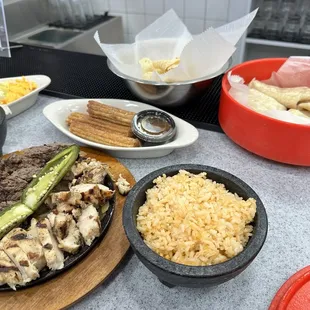 Fresh tortillas, churros, and beef/chicken fajitas for two (includes rice, beans, &amp; toppings)