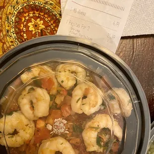 a bowl of shrimp and vegetables