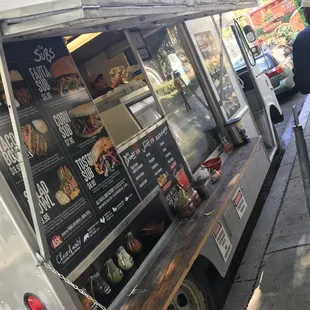 a food truck parked on the side of the street