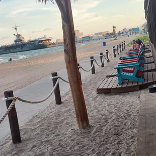 Chairs on the beach to relax and enjoy a refreshing drink and views