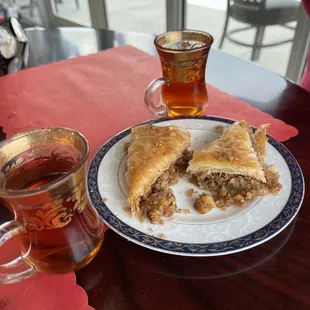 a plate of food and a cup of tea