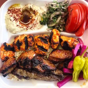 Arax Kabob Combo Plate ~ chicken and beef kabob with a lulu beef skewer, hummus, onions in sumak, tomatoes and radishes...