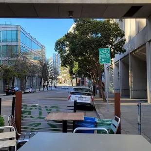 Sitting at the large table in its parklet.