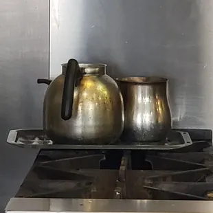 two kettles on the stove