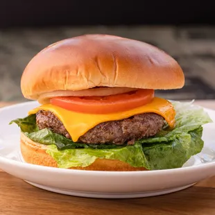 a hamburger with cheese and lettuce