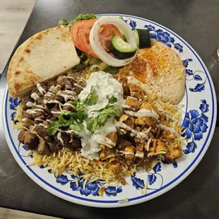Chicken/Gyro combo platter on a pretty plate.