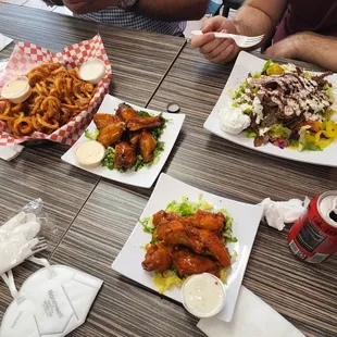 Wings, chicken salad, curly fries