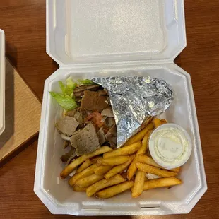 a tray of fries and a sandwich
