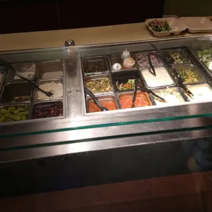 a variety of food in a buffet