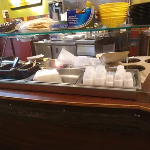 a counter with a variety of food items