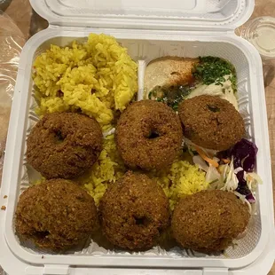 Falafel plate over rice. LOTS of rice! Had hummus as my side to go with the pita