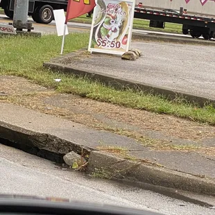 a sign on the side of the road