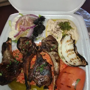 a tray of meat and vegetables