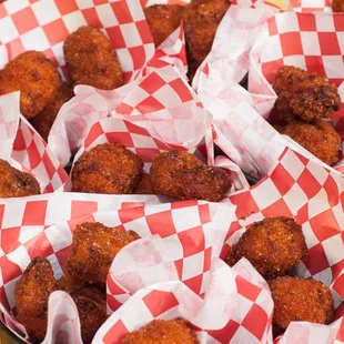 Wild line - caught Alaskan Cod bites. Served with wide selection of dipping sauces