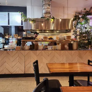 a restaurant with a counter and chairs