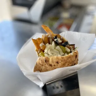 Pita sandwich called &apos;Sabich&apos;. It have hard void egg, eggplant, French fries and all the salads as option.