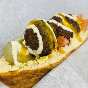a hot dog with toppings