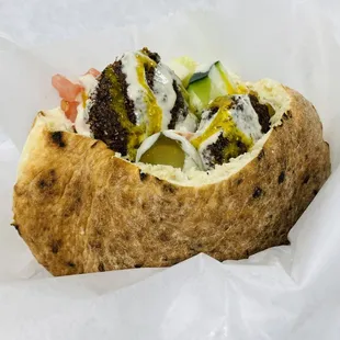 a close up of a sandwich in a wrapper