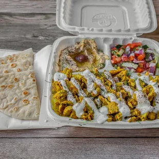 a meal in a styrofoam container